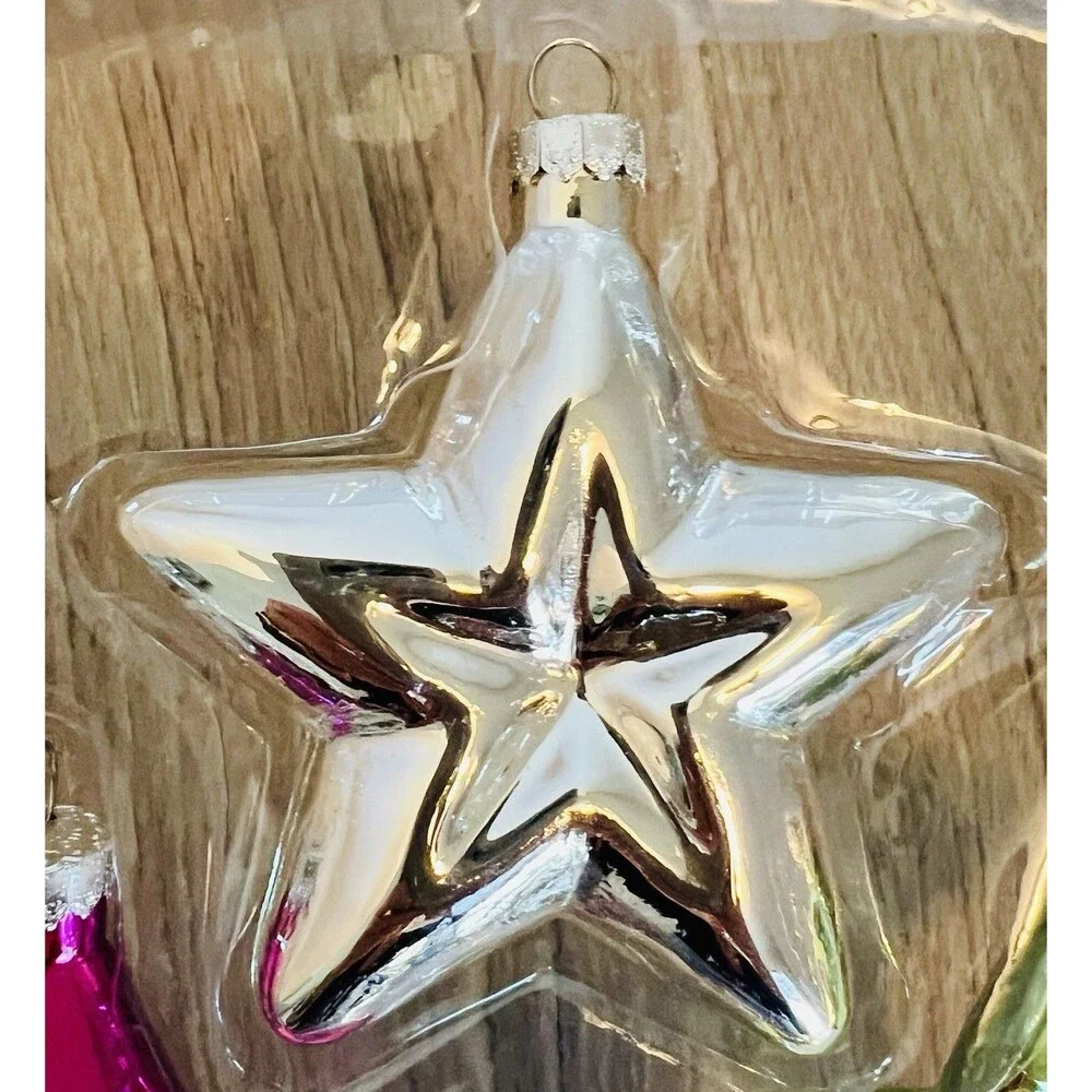 Handcrafted Glass Ornament Set features four star-shaped ornaments metallic